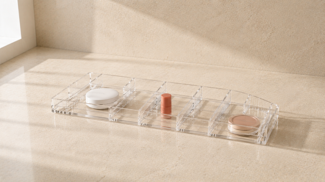 Makeup organizer with adjustable divider sections and open spacing.