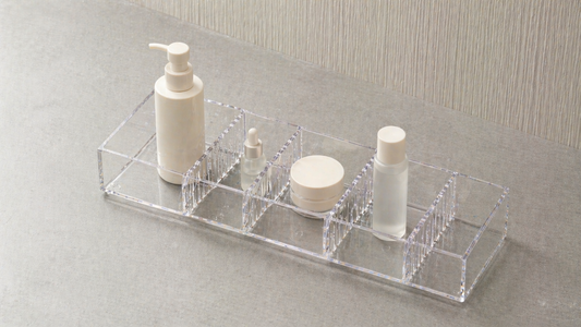 Adjustable vanity organizer with flexible compartments and spacing control.