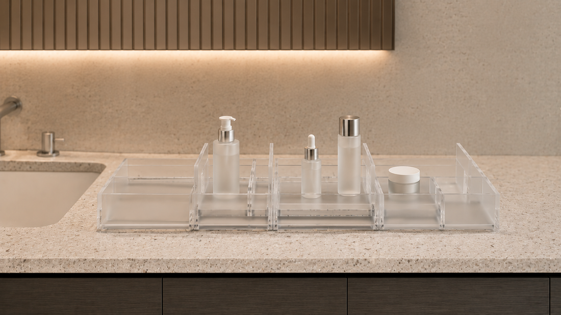 Adjustable bathroom vanity organizer with movable sections and open skincare spacing.