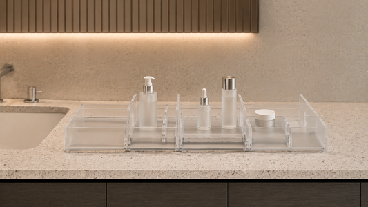 Adjustable bathroom vanity organizer with movable sections and open skincare spacing.