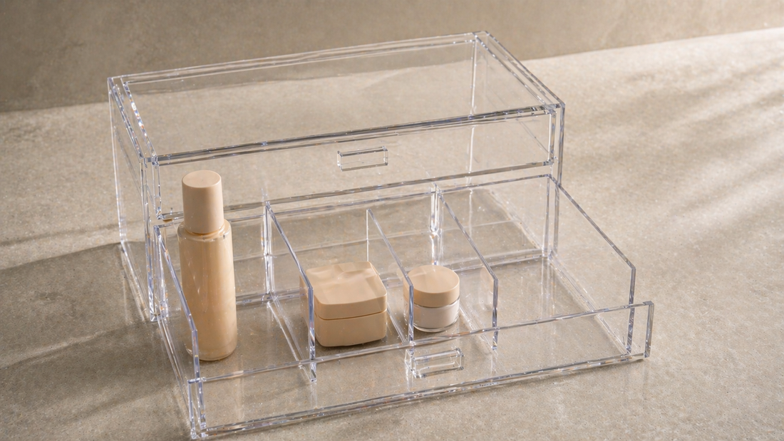 Adjustable acrylic drawer with uneven compartments fitting tall, medium, and small items for flexible storage.