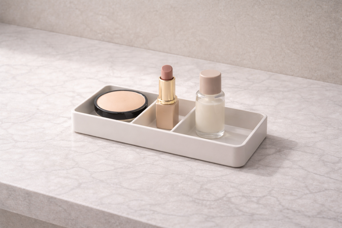 Compact makeup organizer with three items placed in separate compartments and one empty section showing efficient single-step access