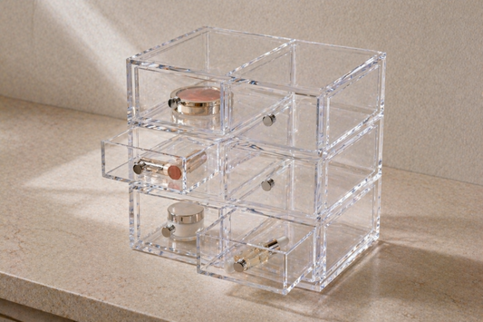 Clear drawer organizer with one item per compartment for precise small item separation.