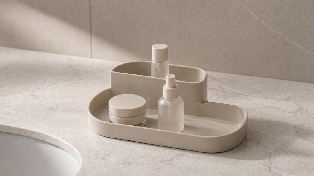 Minimal vanity organizer with essential items placed within easy reach and one empty space, creating an efficient setup that requires no extra movement.