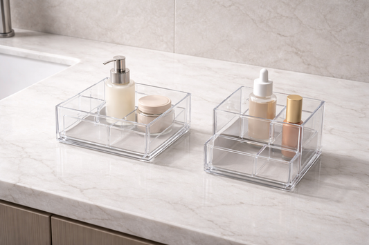 Two separate vanity organizers with distinct item groups and clear gap between zones showing shared storage separation
