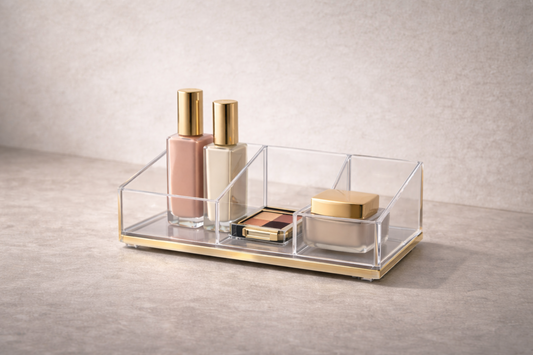 Clear acrylic makeup organizer showing 3–4 essential items in separate compartments, arranged for a complete, ready-to-use daily routine with no need for adjustment.