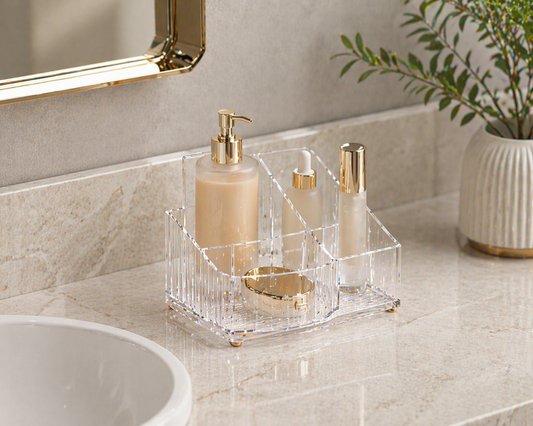 Clear acrylic vanity organizer with 2–4 items arranged in a compact layout to improve usability on limited counter space.