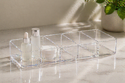 Skincare items separated by category within a clear organizer for faster selection.