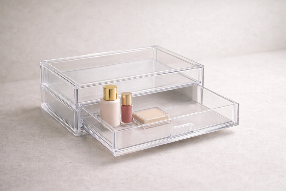 Compact acrylic drawer organizer with three daily makeup items and visible empty space.
