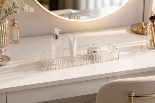 acrylic makeup organizer with separated compartments supporting fast item selection on a small vanity