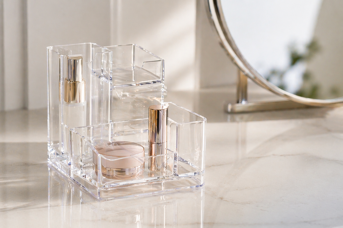 Minimal acrylic organizer with 2–3 items arranged in a compact layout for small vanity surfaces.
