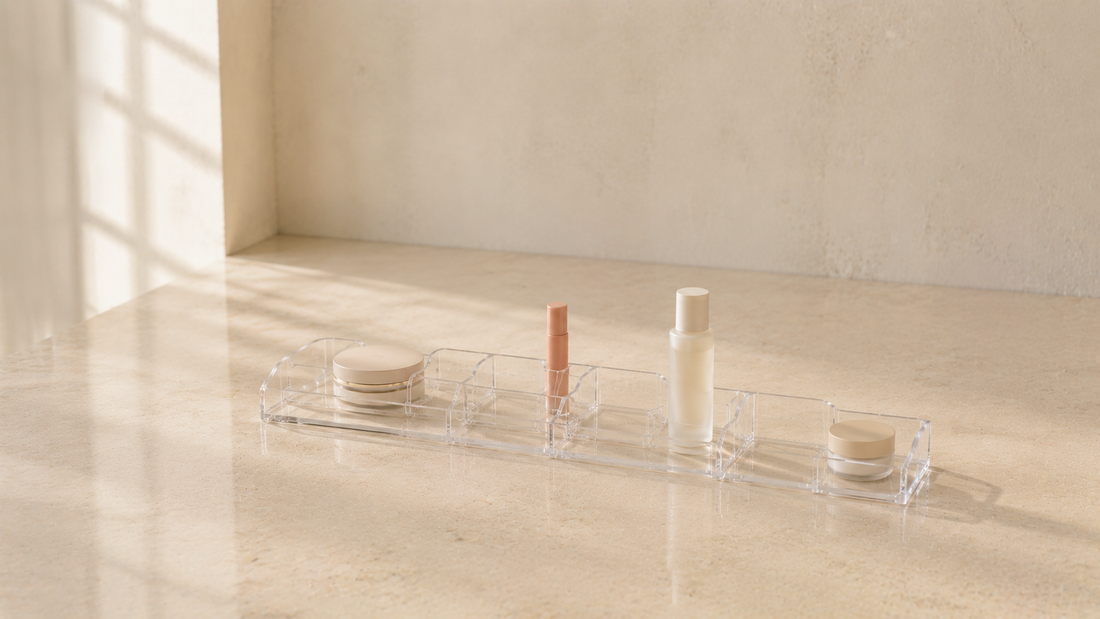 Compact makeup organizer with efficient spacing on a vanity surface.