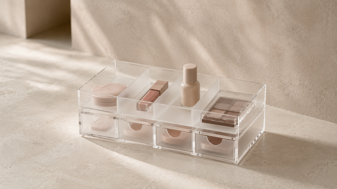 Makeup organizer with separated cosmetic placement and reduced product overlap on a crowded vanity.