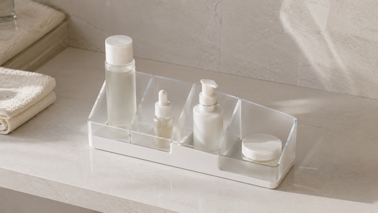 Bathroom vanity organizer with separated skincare sections and open countertop spacing.