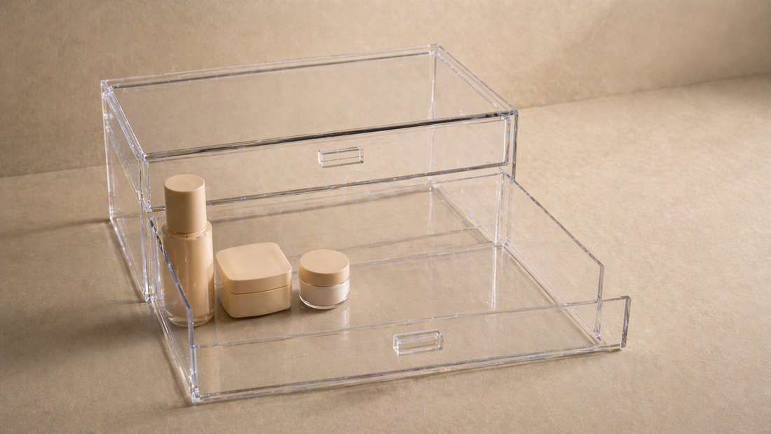 Acrylic drawer with a tight item cluster on one side and open space elsewhere to support faster, repeatable routine flow.