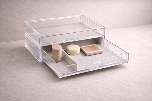 Front-loaded acrylic drawer layout with three daily-use makeup items and empty back space for faster access and reduced hand movement.
