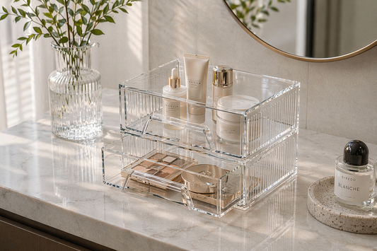 Drawer organizer with minimal items arranged in a controlled layout.