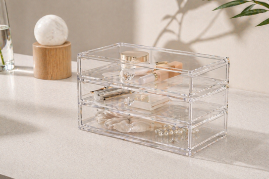 Clear 3-tier drawer organizer with separated items and visible compartments supporting consistent routine flow