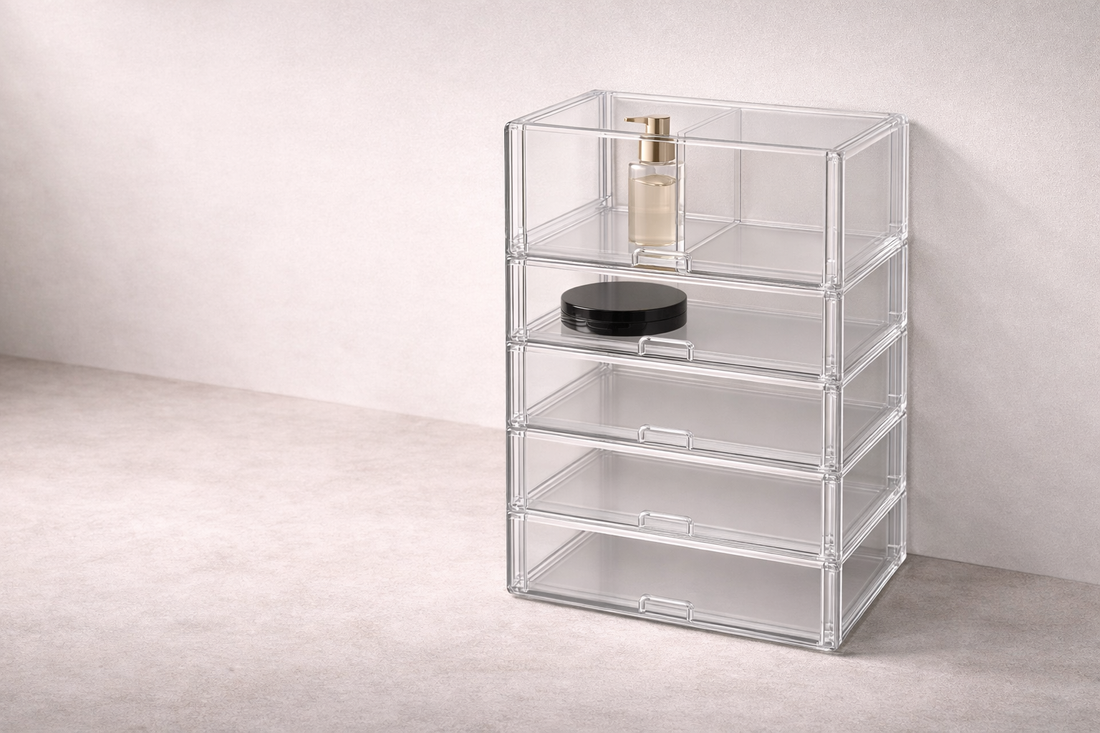 Drawer organizer ideas for fast access featuring a two-tier clear acrylic storage case for cosmetics
