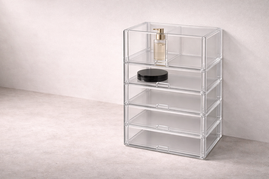Drawer organizer ideas for fast access featuring a two-tier clear acrylic storage case for cosmetics