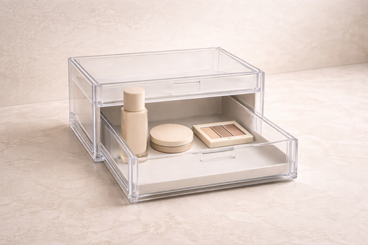 Acrylic drawer with three items positioned in the front access zone and an empty back area to minimize hand movement during routines.