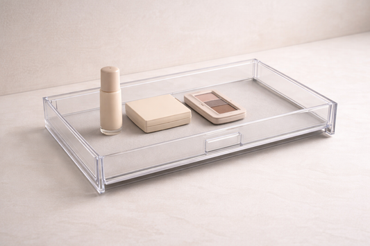 Acrylic drawer layout with three items arranged in a left-to-right sequence with fixed spacing for consistent routine use.