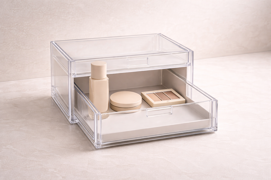 Acrylic drawer with three makeup items from a single category arranged with even spacing and empty space to reduce confusion.