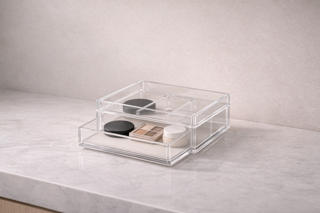 drawer organizer with three items spaced in separate compartments and one empty section