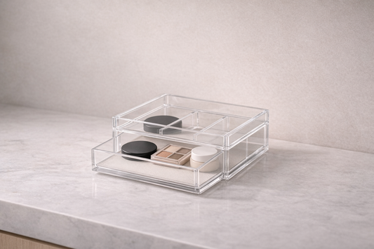drawer organizer with three items spaced in separate compartments and one empty section