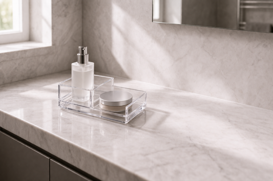Efficient vanity setup for small spaces using a compact tiered acrylic organizer on a bathroom counter