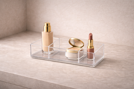Clear acrylic makeup organizer showing 3 items in separate compartments with one empty space, creating a stable, frictionless routine with no need for adjustment.