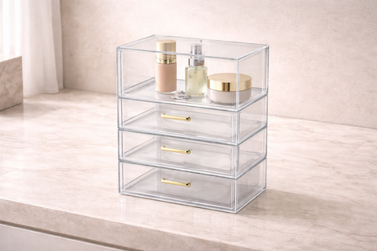 Four-tier acrylic organizer with top layer holding three daily-use items and lower drawers left empty for backup storage separation