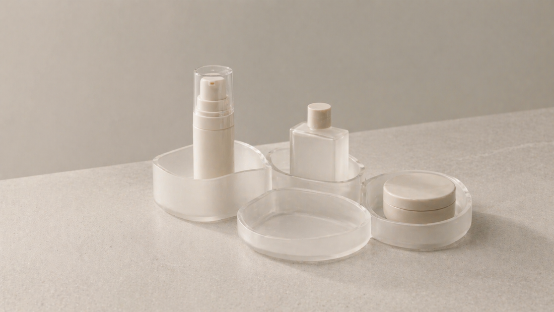 Skincare organizer with fixed item placement in separate compartments and one empty section, forming a consistent layout that remains unchanged over time.