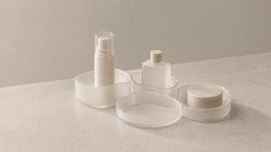 Skincare organizer with fixed item placement in separate compartments and one empty section, forming a consistent layout that remains unchanged over time.