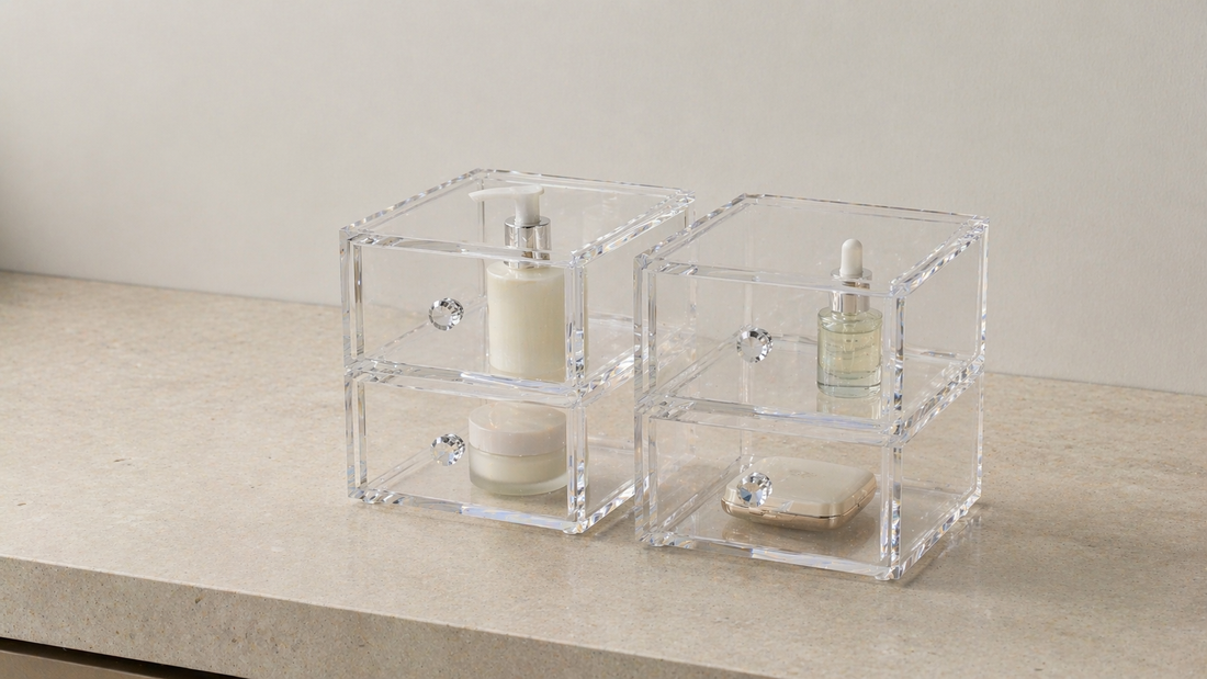 Clear acrylic drawer organizers with evenly spaced items maintaining consistent structure over time.