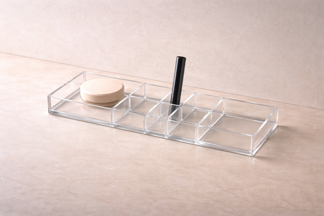 Clear drawer-style acrylic organizer featuring a visibly taller top drawer and vertical divider to reduce search time.