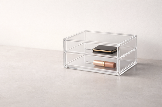 Makeup storage ideas for faster routines featuring a clear contoured acrylic organizer on a sunlit vanity