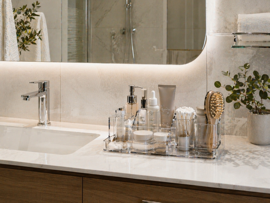 Small bathroom vanity with organized storage layout maintaining a clean and structured surface.