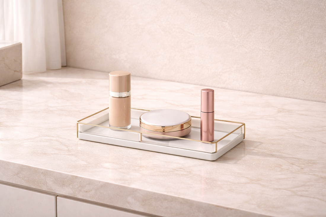 Minimal makeup organizer with three items spaced apart on a clean vanity surface to maintain a clutter-free layout