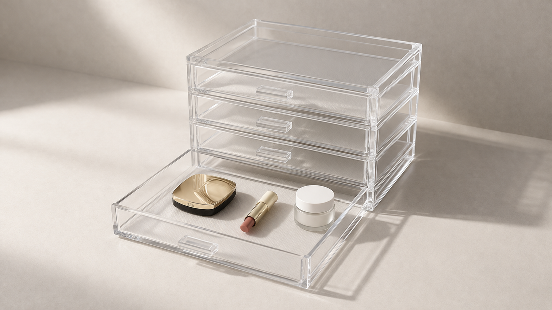 Stackable clear acrylic drawers with one open compartment and minimal items, highlighting modular structure and flexible storage.
