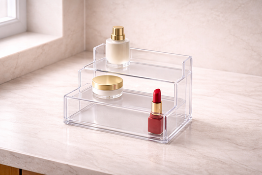 Tiered acrylic organizer with three items arranged in sequence, emphasizing routine-aligned structure and consistent step-by-step retrieval flow.