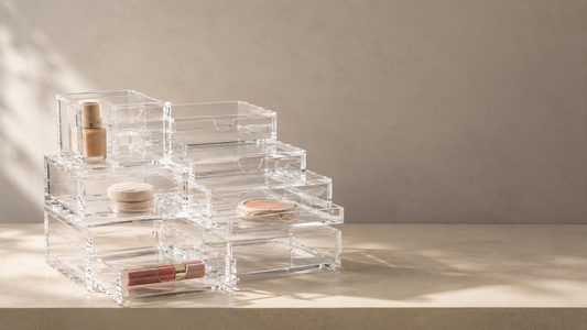 Clear acrylic drawer organizer with separated compartments and stable product placement