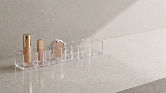 Makeup items arranged in a clear linear sequence with defined separation inside a transparent organizer to support uninterrupted routine flow.