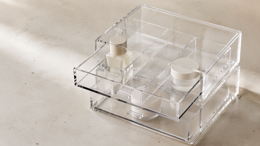 Clear acrylic bathroom vanity storage drawer with a shallow single-layer layout, keeping all items visible and easily accessible without stacking.