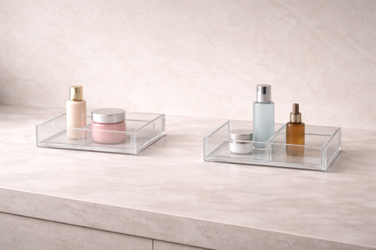 Two separate vanity organizers with a clear empty boundary gap between them, defining individual storage zones for shared use