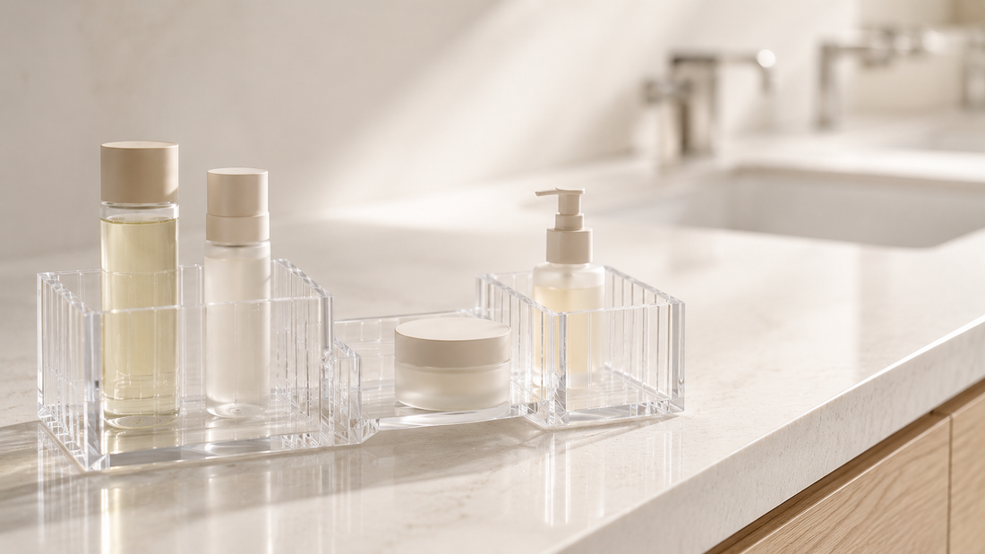 Transparent bathroom vanity organizer with separated compartments for shared counter organization