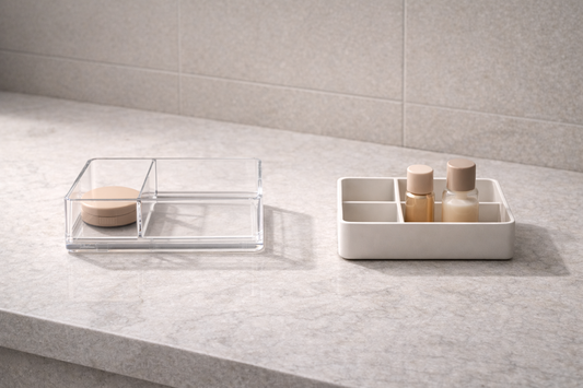 Two separate vanity organizers with distinct item groups and clear gap between zones showing personal storage separation
