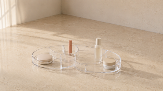 Minimal makeup organizer with simplified spacing and clear product separation.