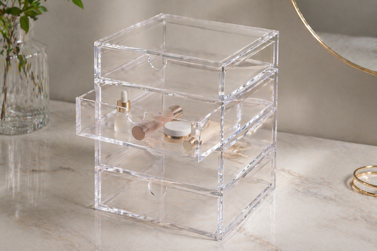 One acrylic drawer used with grouped items while other drawers remain empty for controlled access.