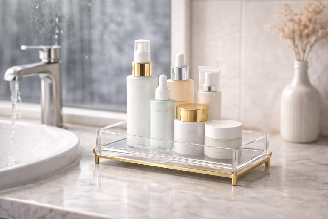 Skincare products arranged on a raised tray near a bathroom sink to reduce water contact.